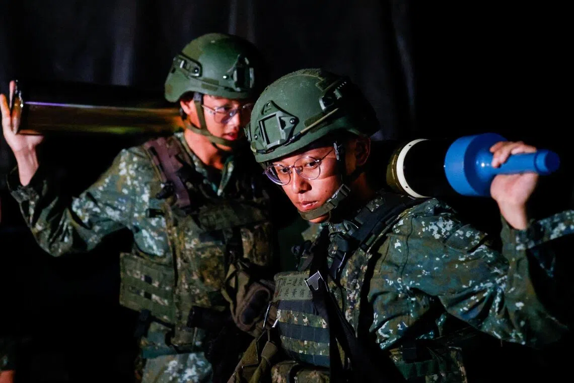 Taiwanese soldiers prepare ammunition for a live-fire drill in Penghu, Taiwan, on Aug 10.