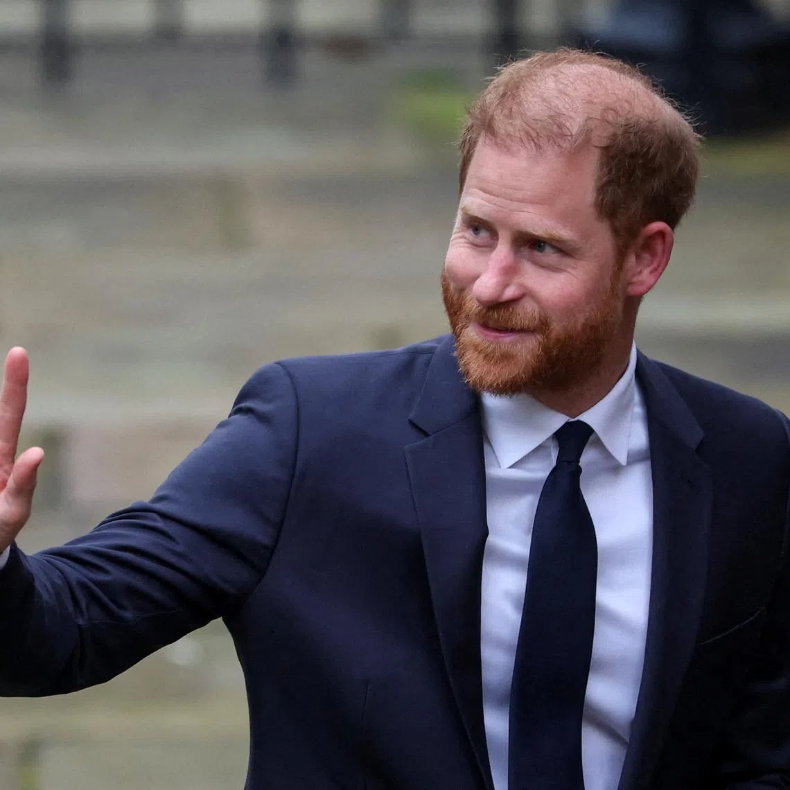 Britain's Prince Harry waves as he arrives to attend the start of the nine-week trial lawsuit against Associated Newspapers, publisher of the Daily Mail, which Britain's Prince Harry and others are suing over allegations of privacy breaches dating back 30 years, at the High Court in London, Britain, January 19, 2026. REUTERS/Isabel Infantes