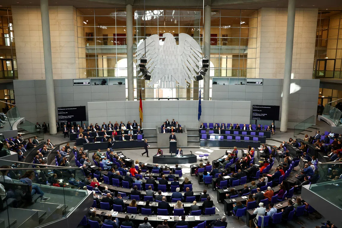 FILE PHOTO: German Chancellor Friedrich Merz speaks during a debate at the Bundestag, in Berlin, Germany, September 24, 2025. REUTERS/Liesa Johannssen/File Photo