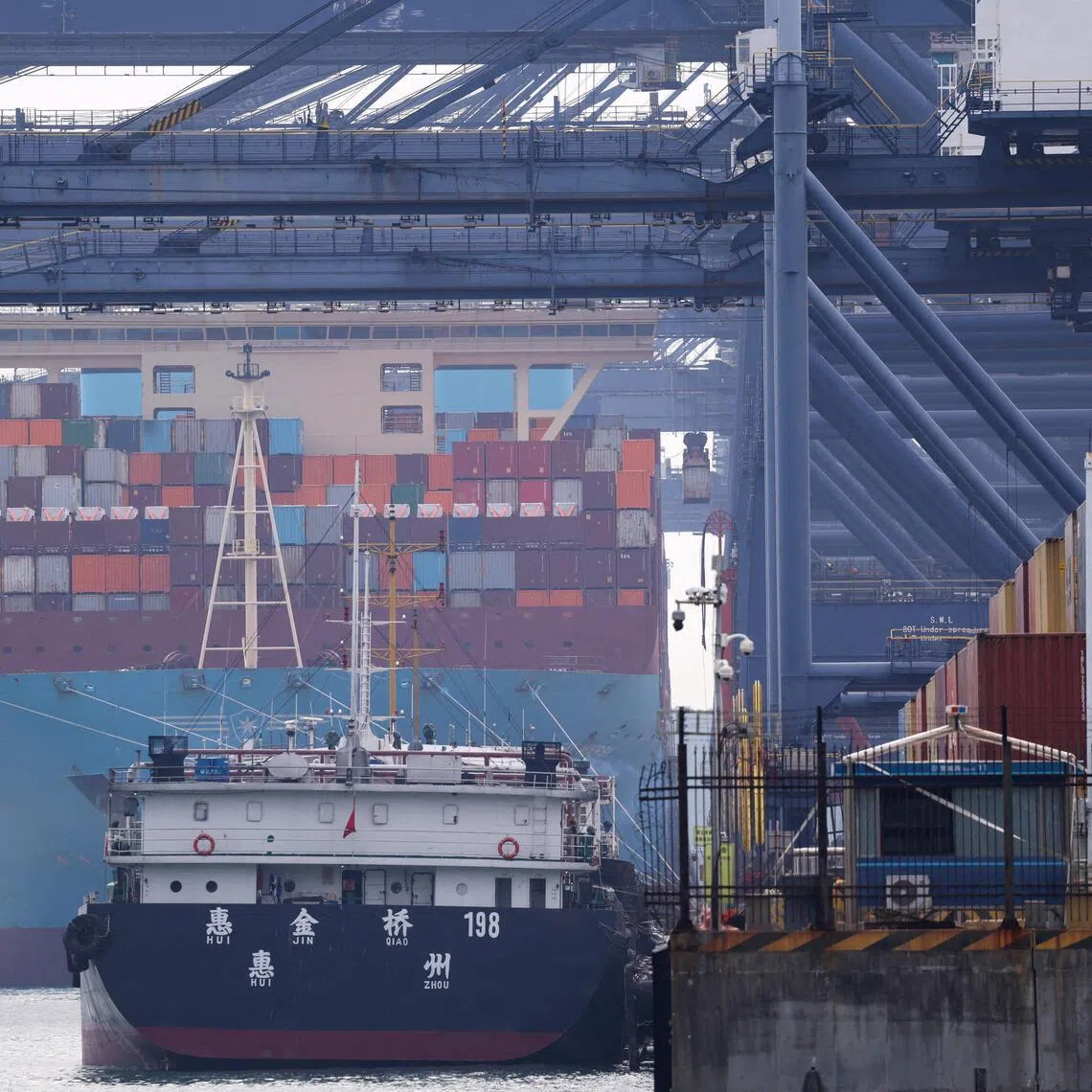 A cargo ship with containers docks at a terminal of the Yantian port in Shenzhen, Guangdong province, China October 30, 2025. REUTERS/Tingshu Wang/File Photo