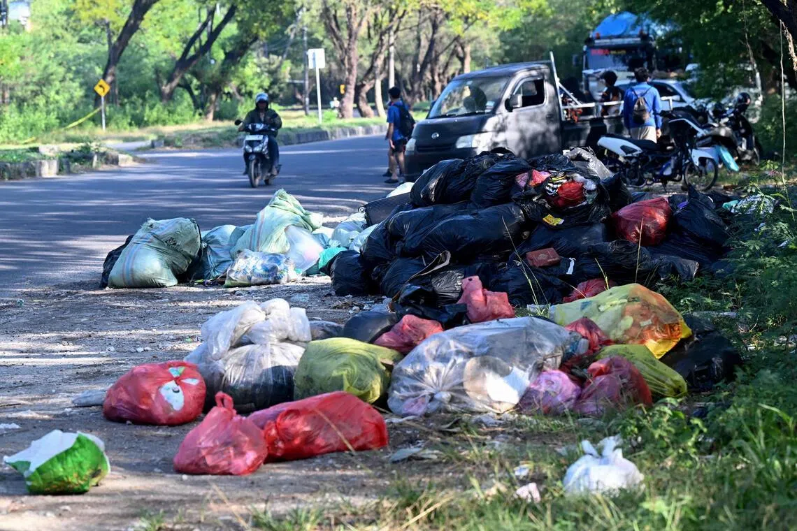 Rubbish piles up on a street in Denpasar on Indonesia's resort island of Bali on April 24.