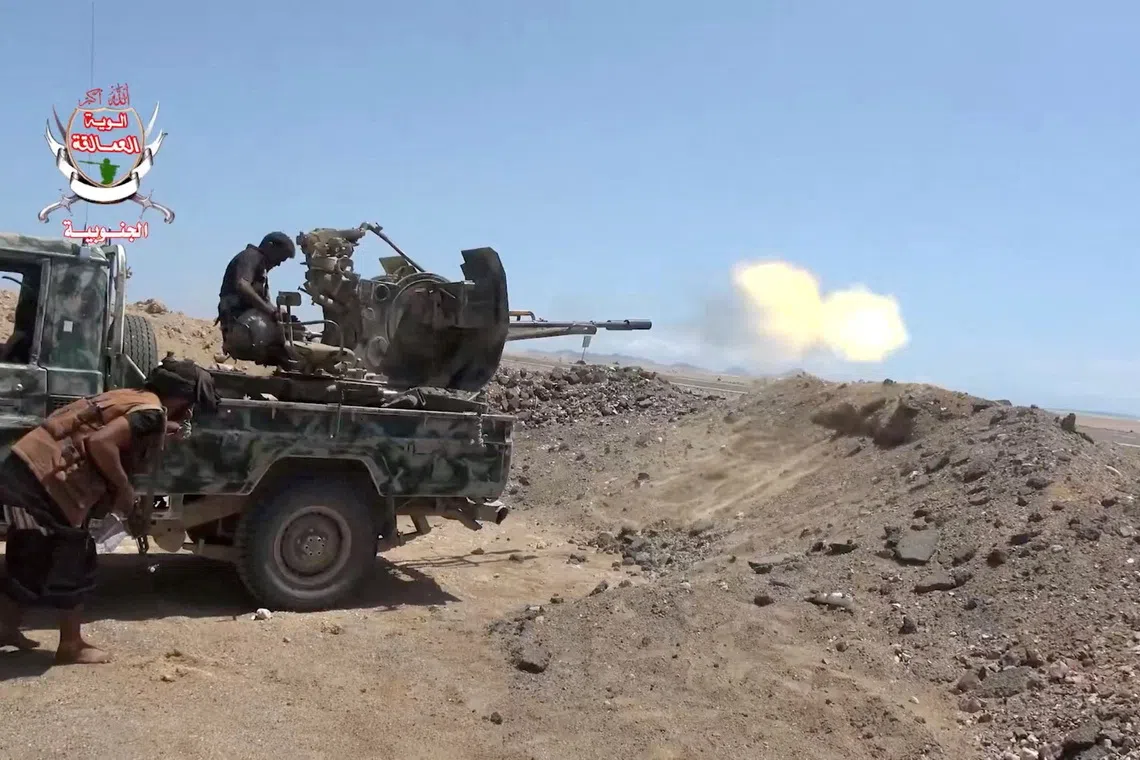 FILE PHOTO: A pro-Saudi-backed Yemeni government fighter fires a vehicle-mounted weapon during what government forces say was an advance against the Iran-backed Houthis, near Dhubab, Taiz Governorate, Yemen, in this still image taken from video released October 5, 2026. Southern Giants Brigades/Handout via REUTERS/File Photo
