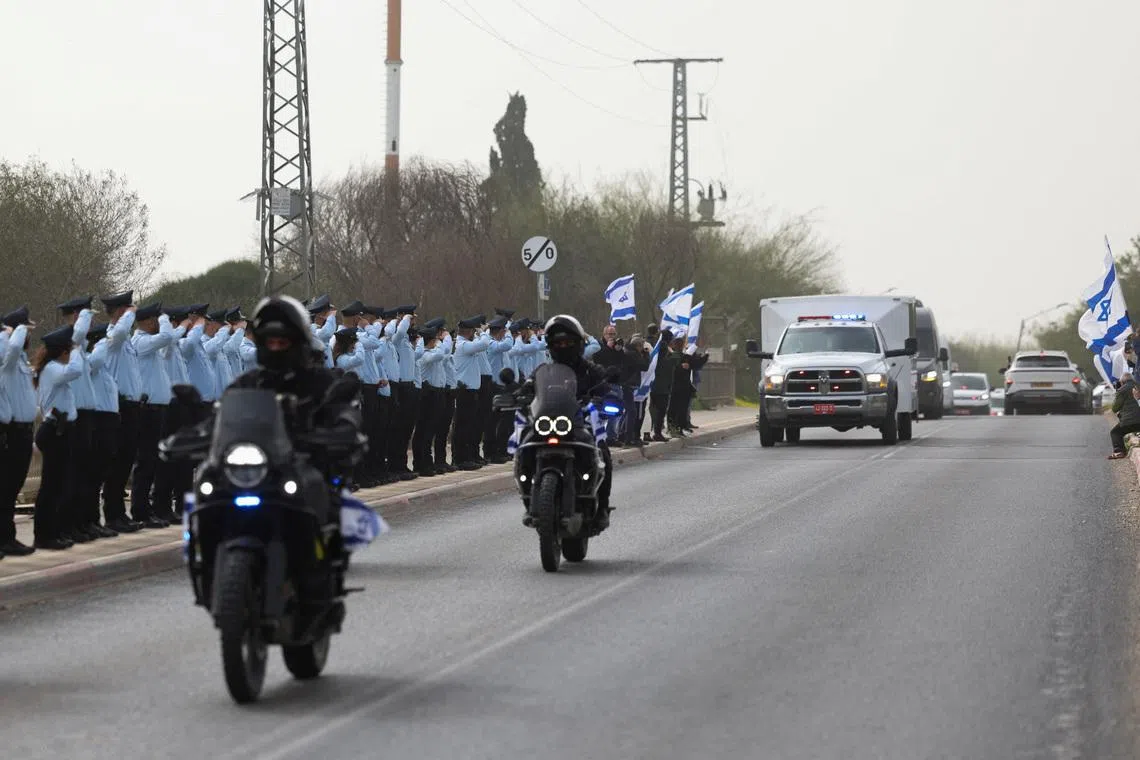 A convoy carrying the remains of Mr Ran Gvili, the last hostage to be retrieved from Gaza, in Ramla, Israel, on Jan 28.