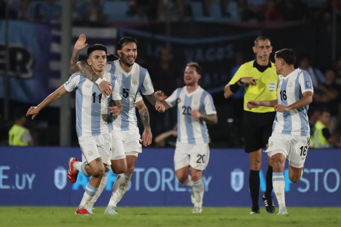 Argentina players celebrate after scoring against Uruguay in their World Cup qualifier.