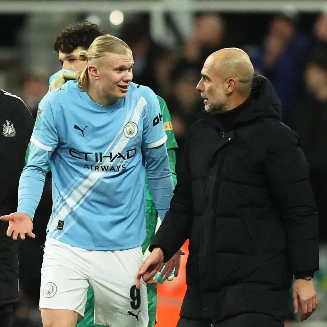 Manchester City manager Pep Guardiola with Erling Haaland during the League Cup semi-final against Newcastle.