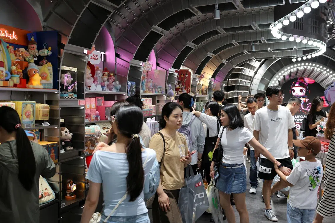 People visit the Pop Mart's flagship store in Shanghai, China June 13, 2025. REUTERS/Go Nakamura