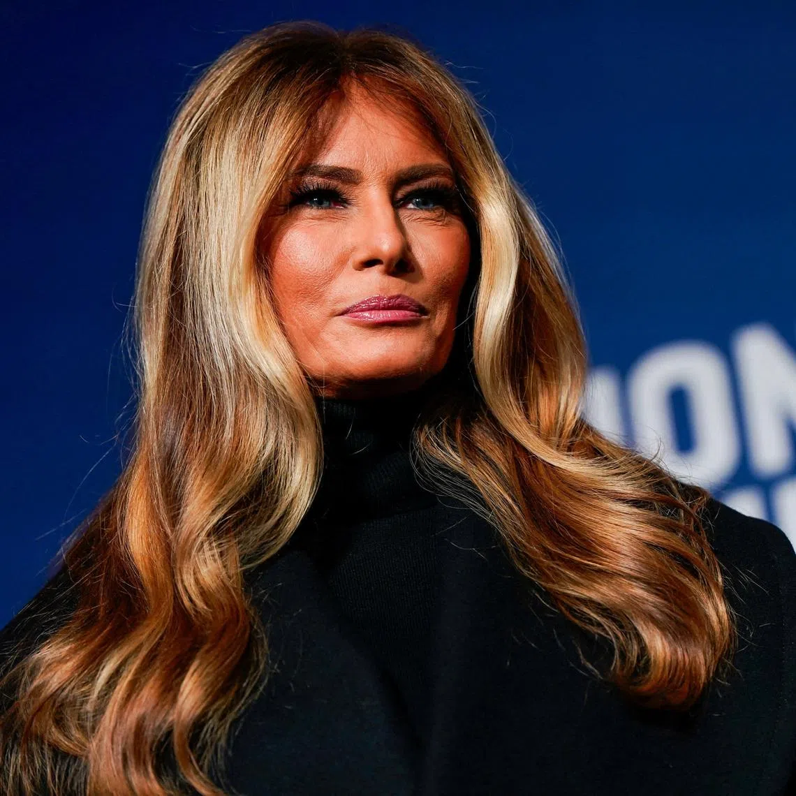 U.S. first lady Melania Trump stands next to her 2025 inaugural gown in the Flag Hall of the Smithsonian's National Museum of American History in Washington, D.C., U.S., February 20, 2026. REUTERS/Elizabeth Frantz