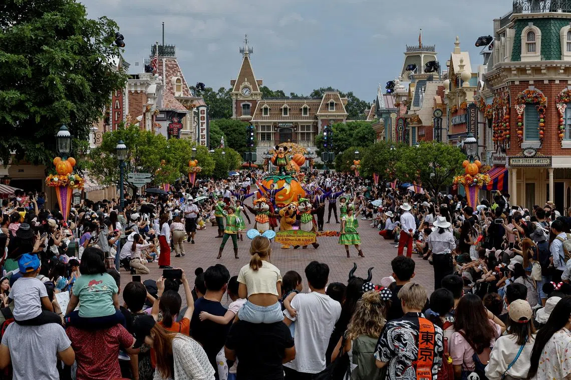 Visitors watch the Halloween programme at a parade at Hong Kong Disneyland.