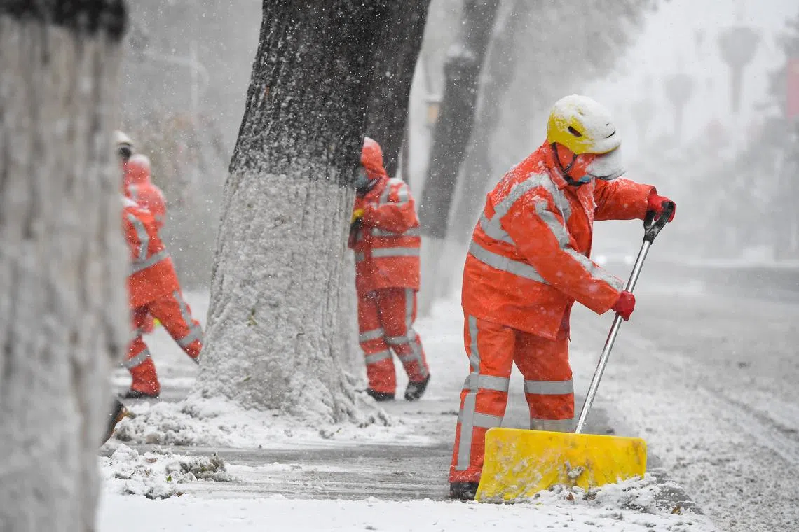 epa10960543 Municipal workers clear snow from a pavement in Changchun, northeast China's Jilin Province, 06 November 2023. A cold front has ushered in strong winds and heavy snowfall across northern and northeastern China since Sunday. In response, local authorities have implemented emergency measures, including the temporary suspension of classes and business operations, along with an early activation of heating systems.  EPA-EFE/XINHUA / Zhang Nan CHINA OUT / UK AND IRELAND OUT  /       MANDATORY CREDIT  EDITORIAL USE ONLY  EDITORIAL USE ONLY