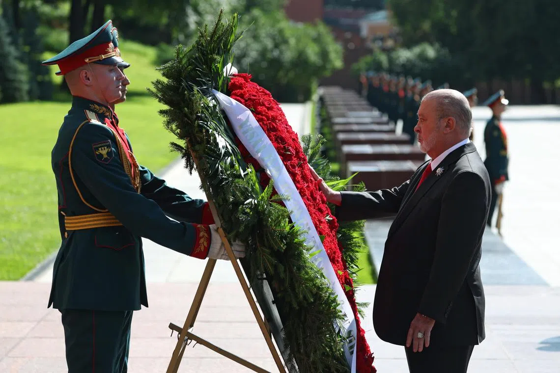 Malaysia's King Sultan Ibrahim  Iskandar (right) takes part in a wreath-laying ceremony at the Tomb of the Unknown Soldier in Moscow, Russia.
