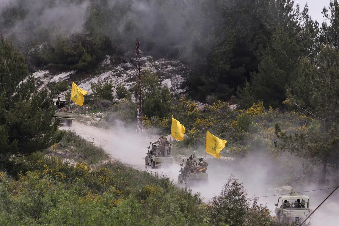 Hezbollah members take part in a military exercise during a media tour organized for the occasion of Resistance and Liberation Day, in Aaramta, Lebanon. REUTERS/Aziz Taher/File photo