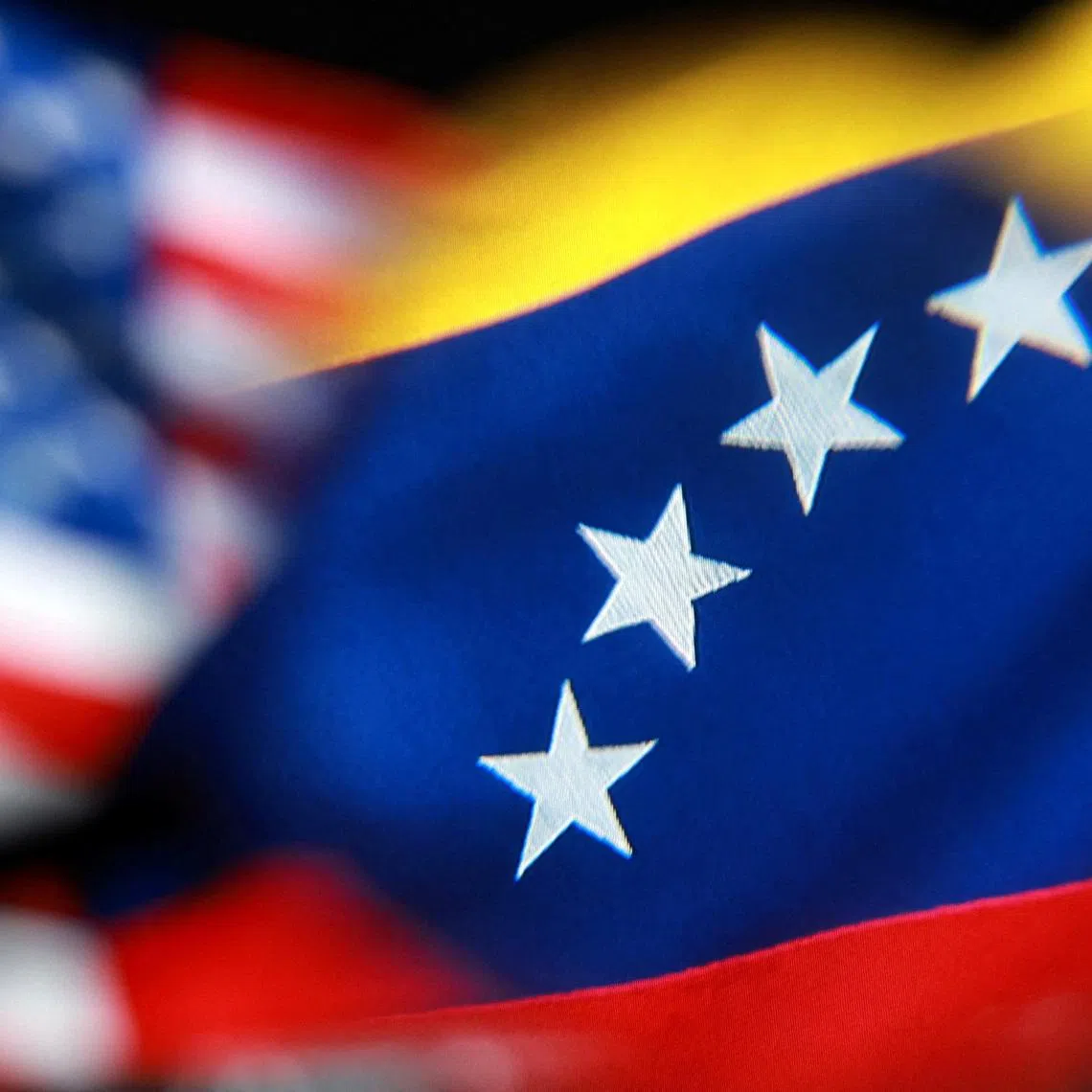 U.S. and Venezuelan flags appear in this illustration taken December 2, 2025. REUTERS/Dado Ruvic/Illustration