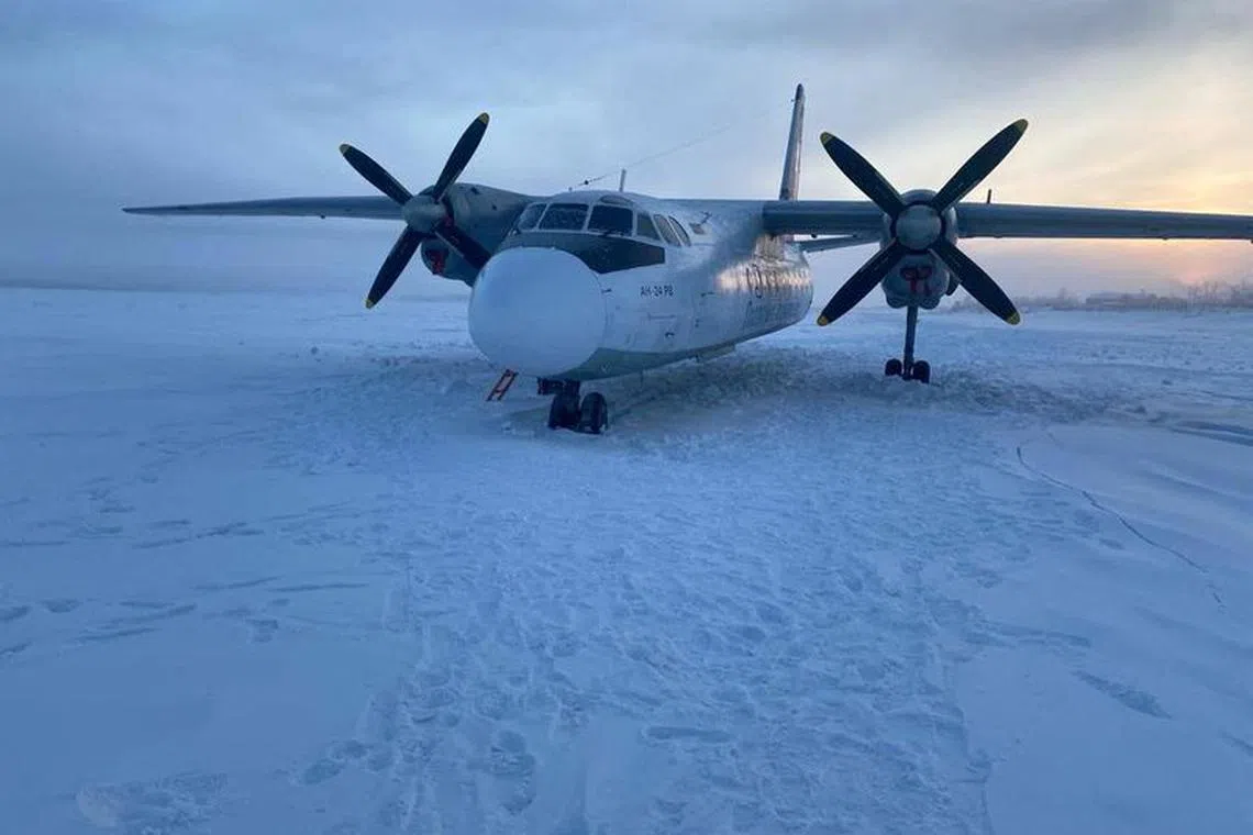 A view shows a Polar Airlines' Antonov-24 passenger aircraft following its landing on the Kolyma river near an airport in Zyryanka in the Yakutia region, Russia, December 28, 2023. Russia's Eastern Siberian Transport Prosecutor's Office/Handout via REUTERS