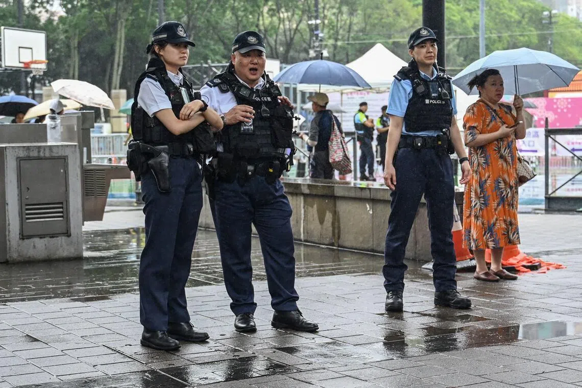 Police are seen at Victoria Park in the Causeway Bay district of Hong Kong on June 3, 2023, where people traditionally gathered annually on June 4 to mourn the victims of China's Tiananmen Square crackdown in 1989 which the authorities have banned and vowed to stamp out any protests on the anniversary. (Photo by Peter PARKS / AFP)