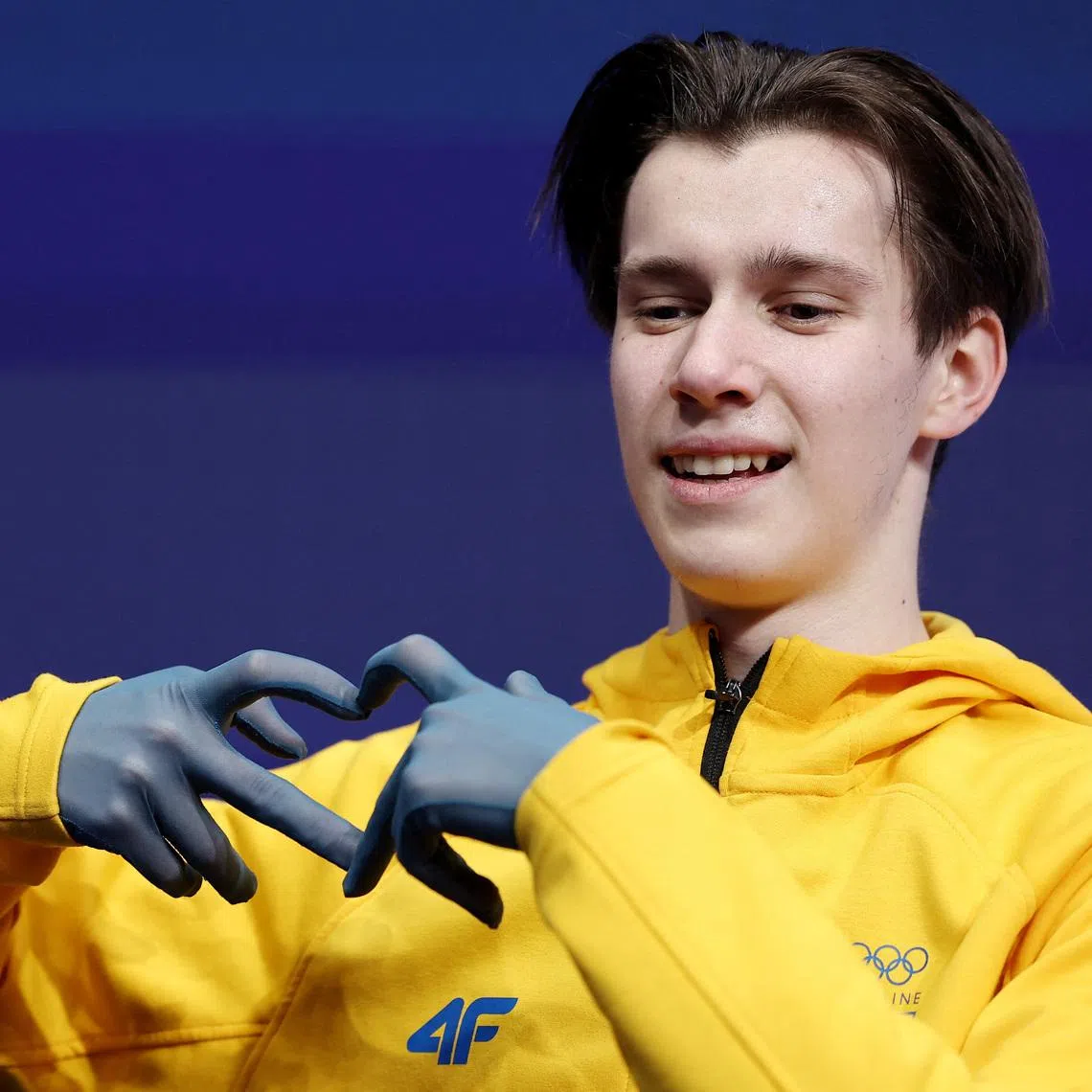 Milano Cortina 2026 Olympics - Figure Skating - Men Single Skating - Short Program - Milano Ice Skating Arena, Milan, Italy - February 10, 2026. Kyrylo Marsak of Ukraine reacts after his performance during the Short Program REUTERS/Amanda Perobelli