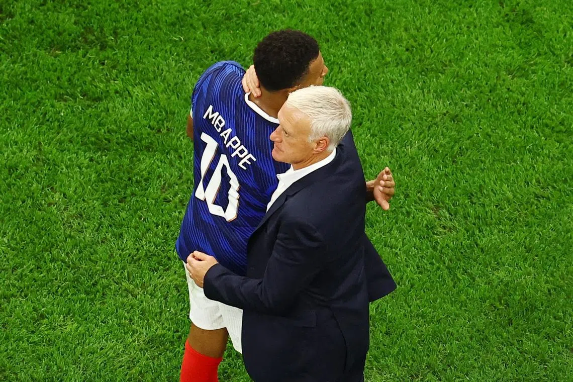 Soccer Football - FIFA World Cup 2026 - Semi Final - France v Spain - Dallas Stadium, Arlington, Texas, U.S. - July 14, 2026 France's Kylian Mbappe embraces coach Didier Deschamps after the match REUTERS/Marco Bello/File Photo