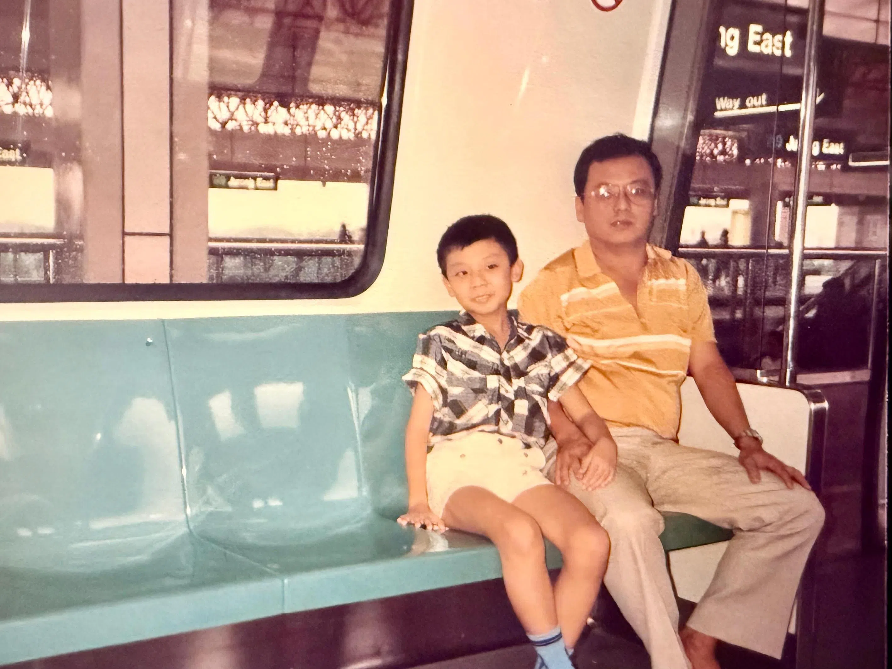 The young Jeffrey Siow on an MRT train ride with his father.