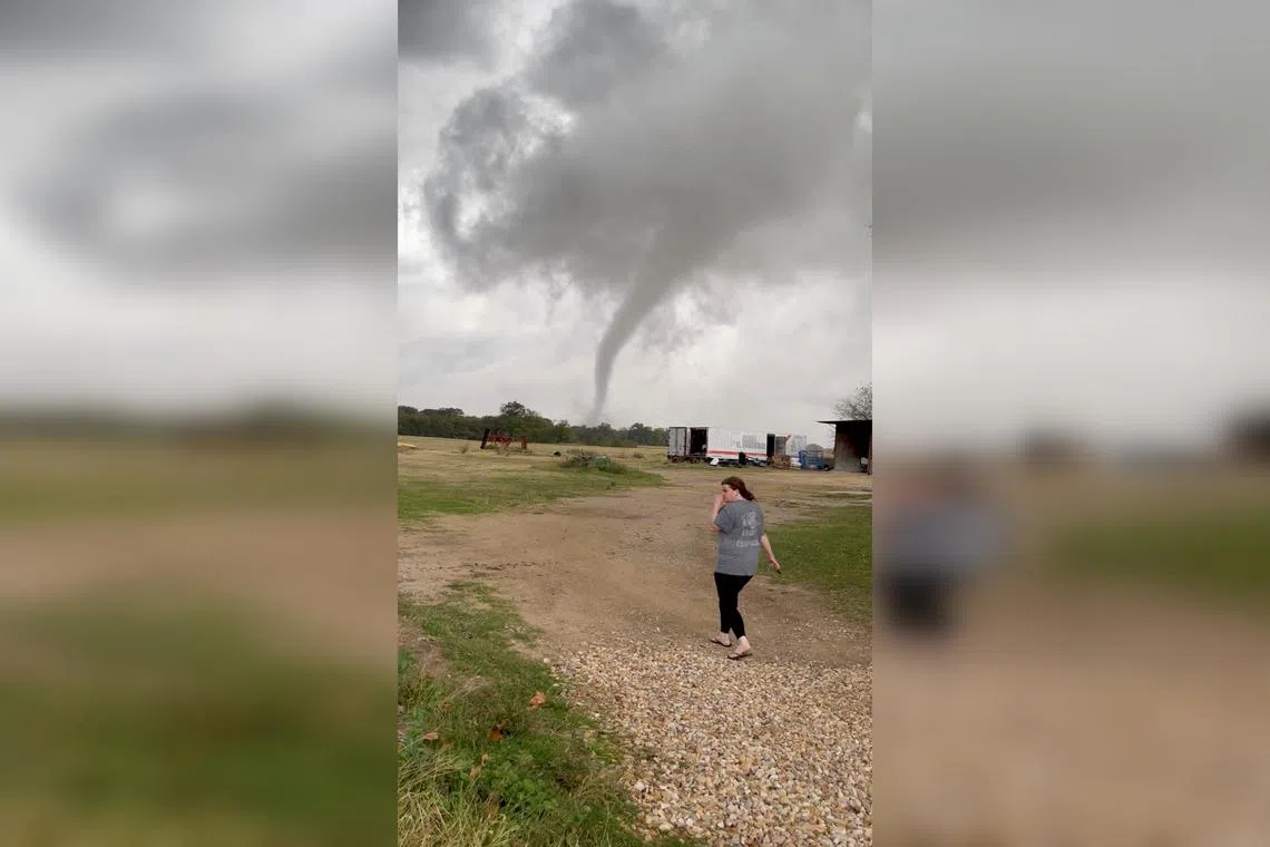 A tornado is seen on a farm in Greenview, Texas, on Nov 4, 2022, in a screenshot from a social media video.