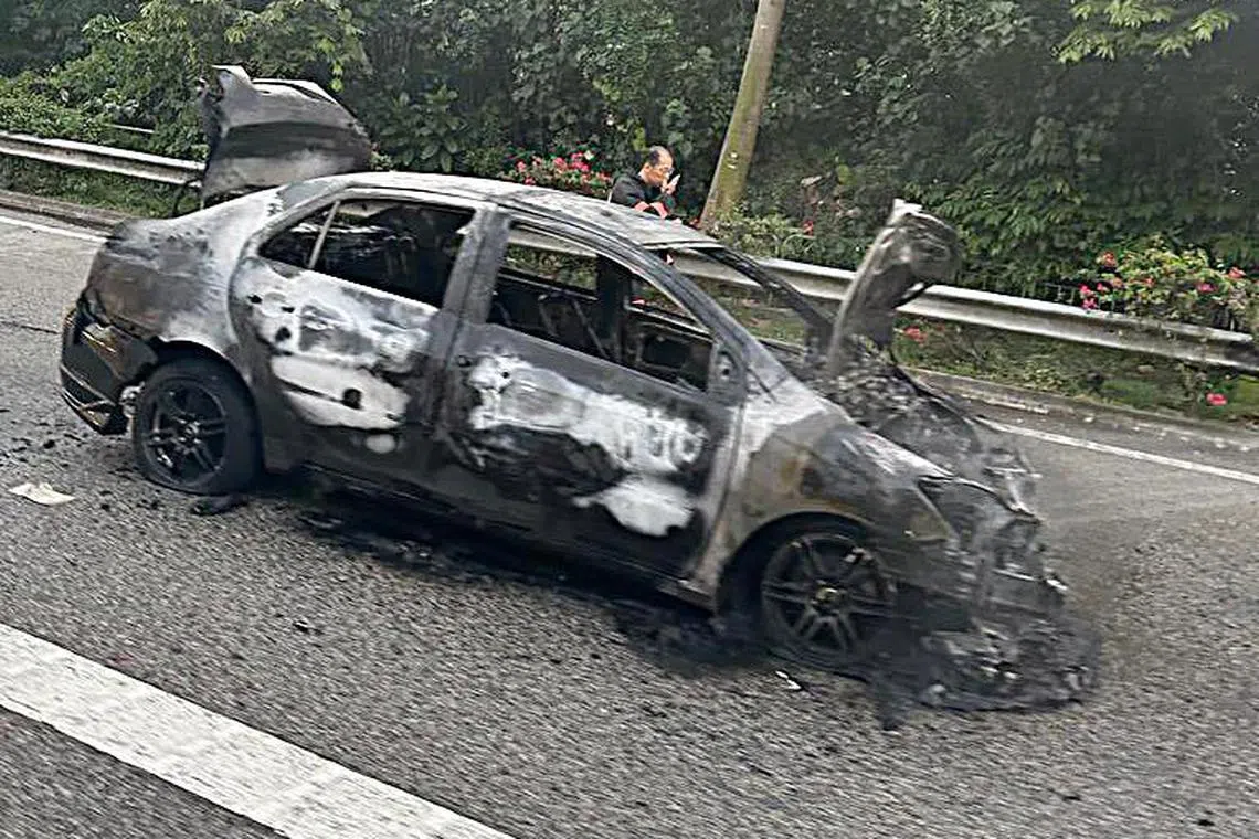 The charred chassis of a black car following an accident which led to it catching fire on Sept 15, 2023.