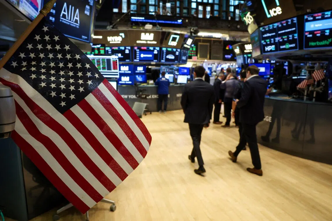 Traders working on the floor of the New York Stock Exchange, in New York City, on Nov 19.