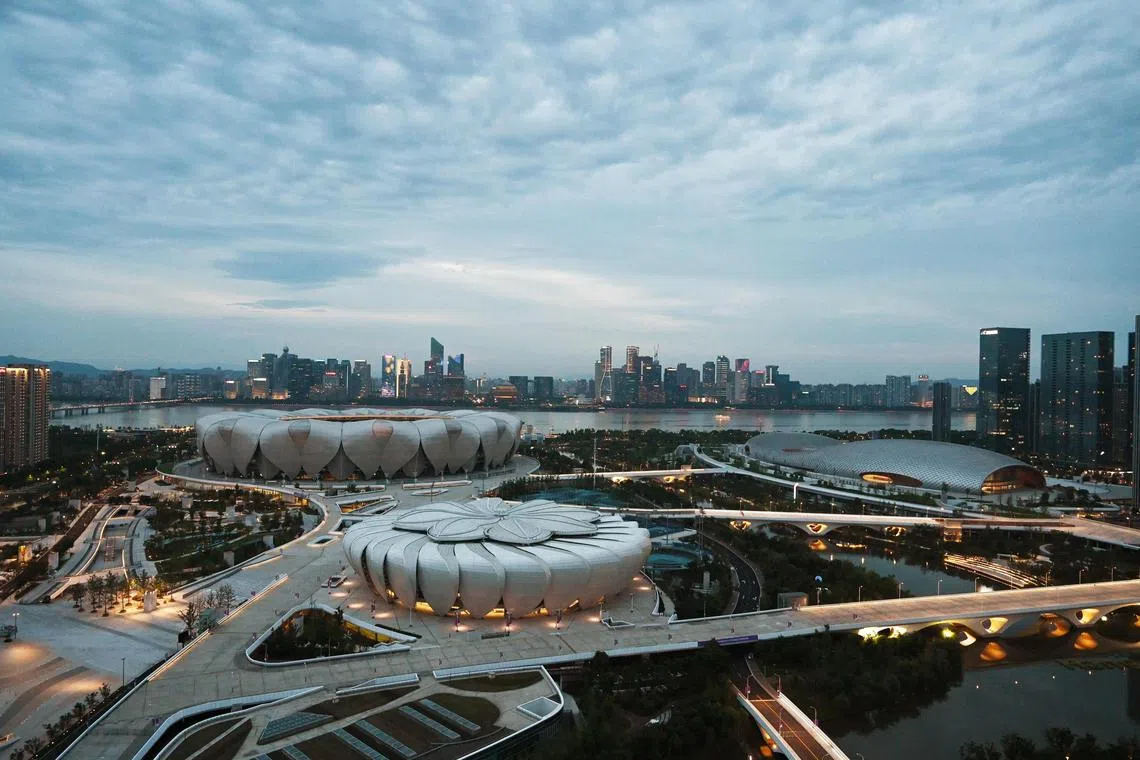A view of the Hangzhou Olympic Sports Center, including the Gymnasium and Aquatics Centre (right), Tennis Centre (front) and main stadium (back).