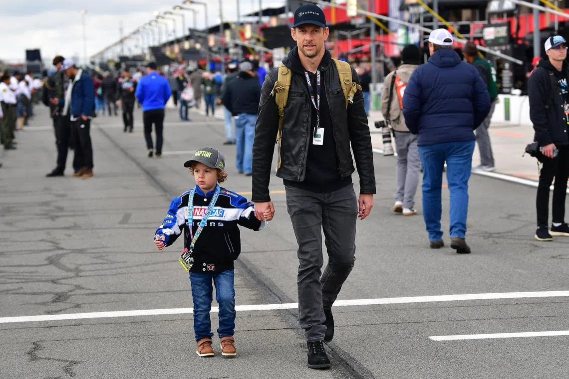 Former Formula One driver Jenson Button with son Hendrix at the Pala Casino 400 at Auto Club Speedway in Fontana, California, on Feb 26, 2023.