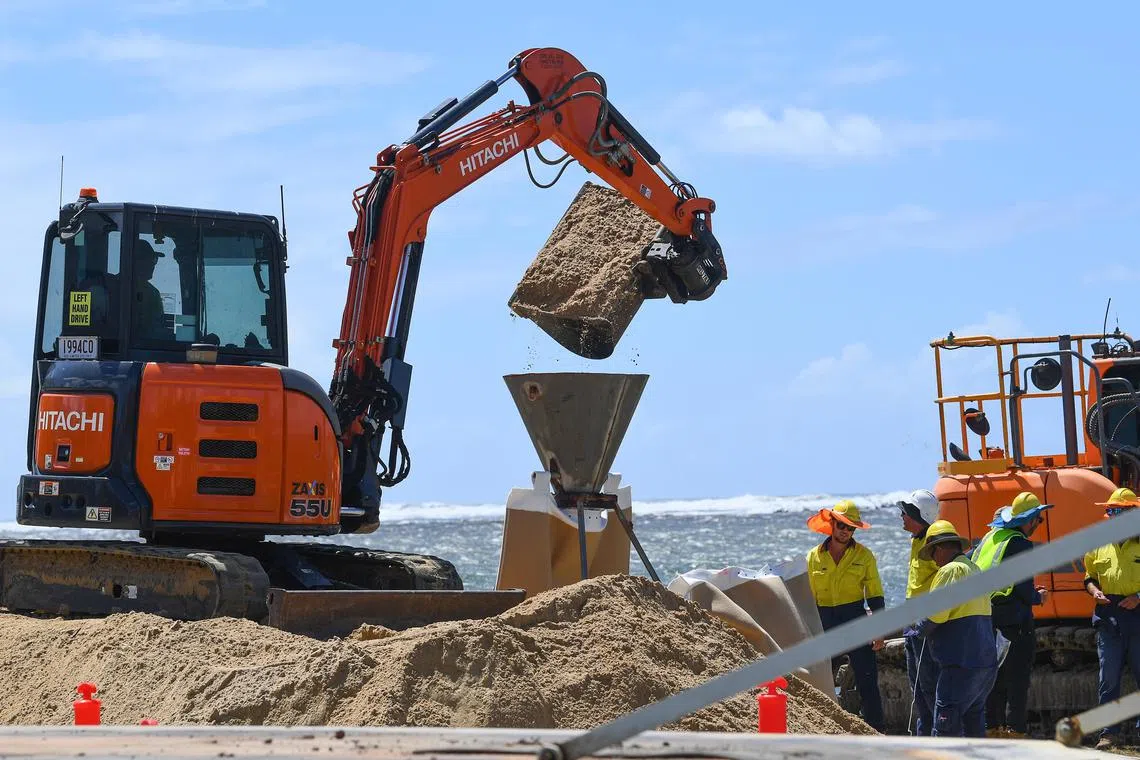 Giant sandbags are laid at the Caloundra Power Boat Club  near the Pumicestone Passage close to Brisbane, Australia on March 4, 2025. Residents are advised to prepare for the incoming tropical Cyclone Alfred which is due to make landfall later in the week.
