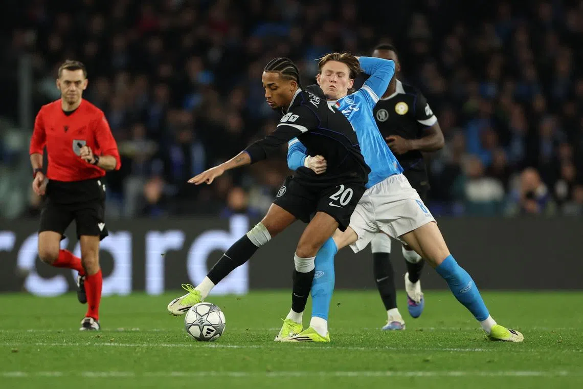 Soccer Football - UEFA Champions League - Napoli v Chelsea - Stadio Diego Armando Maradona, Naples, Italy - January 28, 2026 Chelsea's Joao Pedro in action with Napoli's Scott McTominay REUTERS/Ciro De Luca