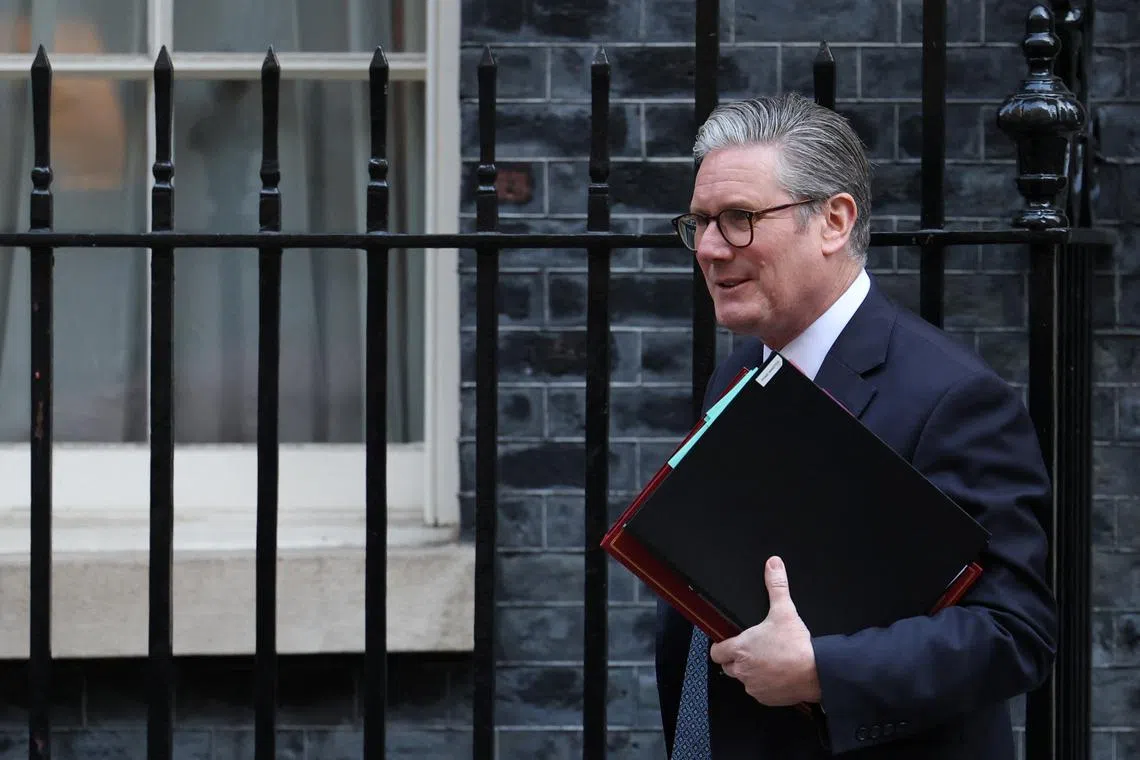 FILE PHOTO: British Prime Minister Keir Starmer leaves 10 Downing Street in London, Britain, April 2, 2025. REUTERS/Sodiq Adelakun/ File Photo