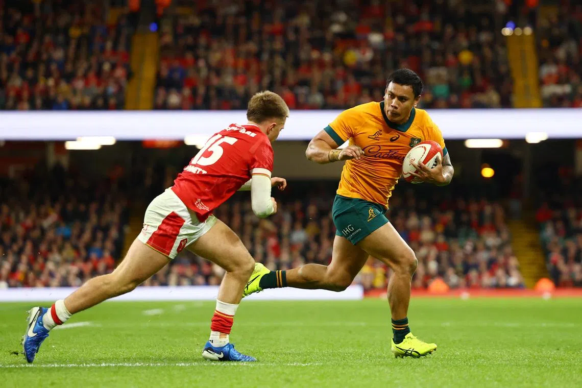 FILE PHOTO: Rugby Union - Autumn Internationals - Wales v Australia - Millennium Stadium, Cardiff, Wales, Britain - November 17, 2024 Australia's Len Ikitau in action before scoring a try Action Images via Reuters/Matthew Childs/File Photo