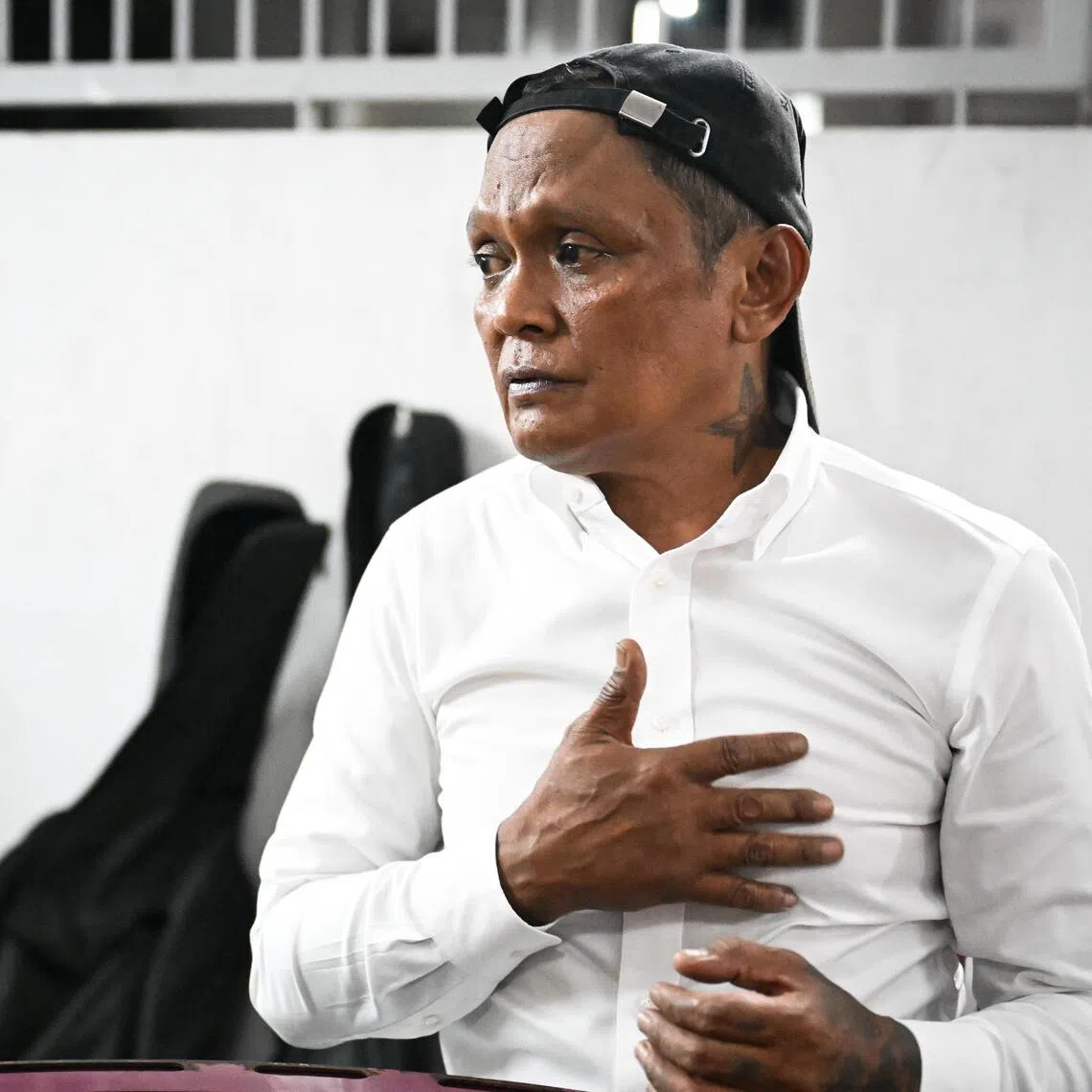Osman saw a knife-wielding man stabbing himself and without hesitation, rushed forward to stop him after handing his belongings, including a guitar, to his wife.