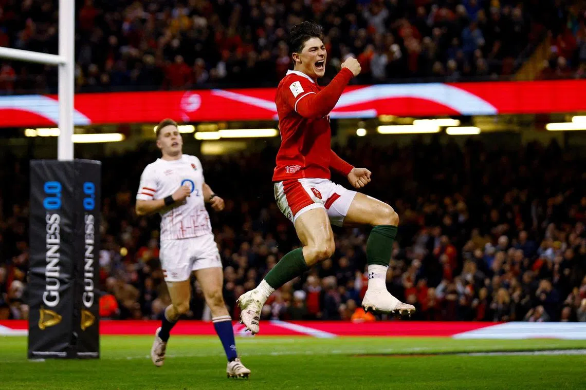 Former Wales winger Louis Rees-Zammit celebrating after scoring a try against England in the Six Nations Championship on February 25, 2023. He has since quit rugby to try his hand at finding a National Football League team.