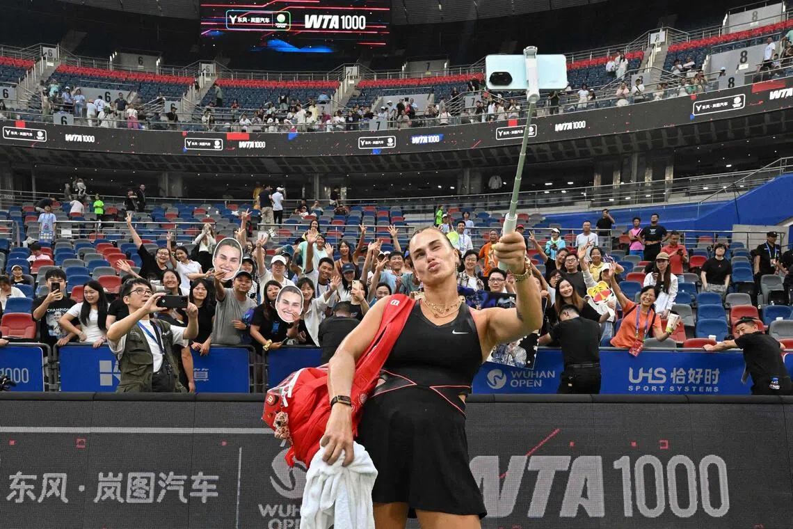 Aryna Sabalenka taking a wefie with fans after winning her women’s singles match against Liudmila Samsonova at the Wuhan Open on Oct 9.