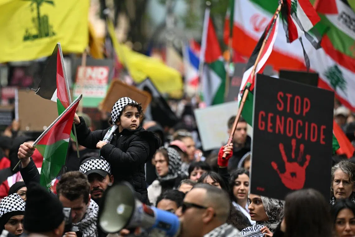 Protesters march during a Pro-Palestine rally at the State Library of Victoria in Melbourne, Australia, on Sept 29.