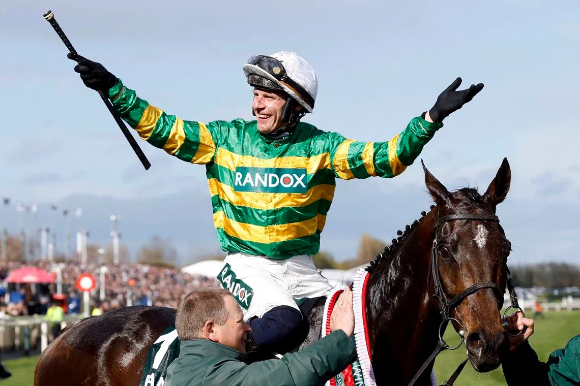 Horse Racing - Grand National Festival 2026 - Aintree Racecourse, Liverpool, Britain - April 11, 2026 Paul Townend riding I Am Maximus celebrates winning the 16:00 Randox Grand National Handicap Chase Action Images via Reuters/Peter Cziborra