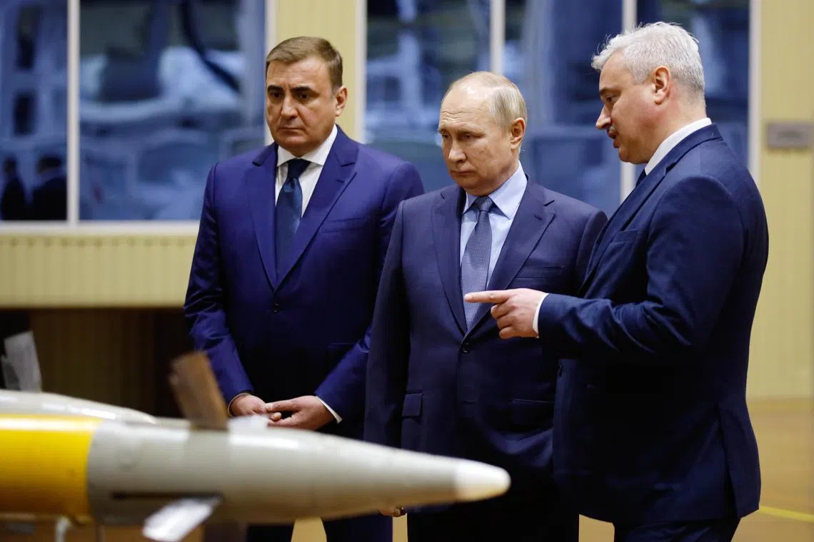 Russian President Vladimir Putin (centre) visits a centre for arms manufacturing in Tula, Russia. on Dec 23, 2022.