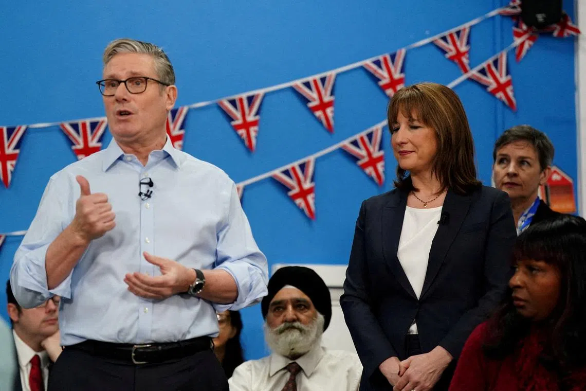 FILE PHOTO: Britain's Chancellor of the Exchequer Rachel Reeves stands next to Prime Minister Keir Starmer in Rugby, Warwickshire, Britain, November 27, 2025.    Jacob King/Pool via REUTERS/File Photo