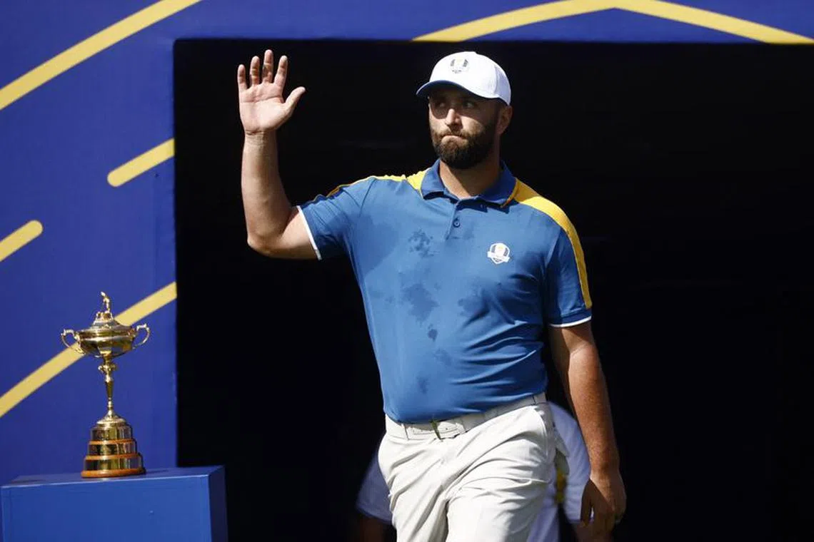 Golf - The 2023 Ryder Cup - Marco Simone Golf & Country Club, Rome, Italy - October 1, 2023 Team Europe's Jon Rahm acknowledges the crowd as he walks past the Ryder Cup trophy on the 1st hole during the Singles REUTERS/Yara Nardi/File Photo