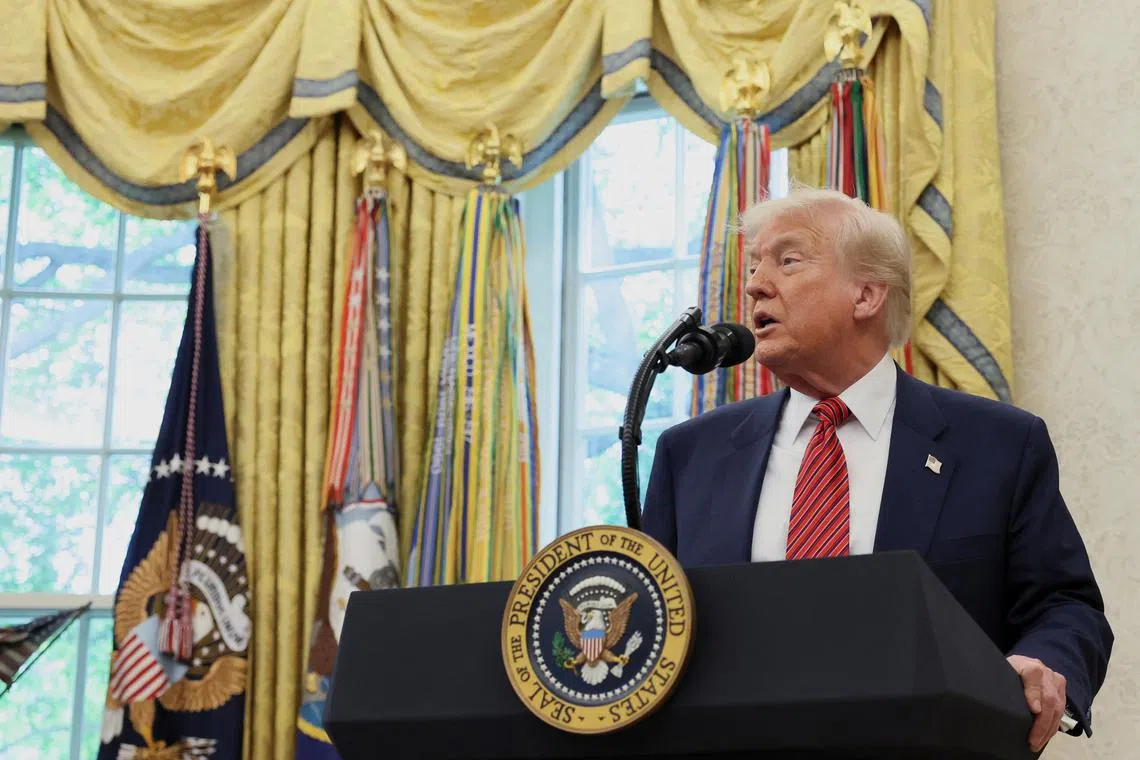 FILE PHOTO: U.S. President Donald Trump takes questions from the media following former U.S. Senator David Perdue's swearing-in ceremony to be the new U.S. ambassador to China, at the White House in Washington, D.C., U.S., May 7, 2025. REUTERS/Leah Millis/File Photo