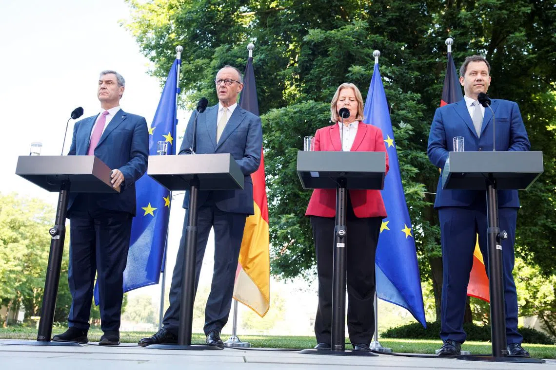 Under fire German ruling coalition unveils reform package