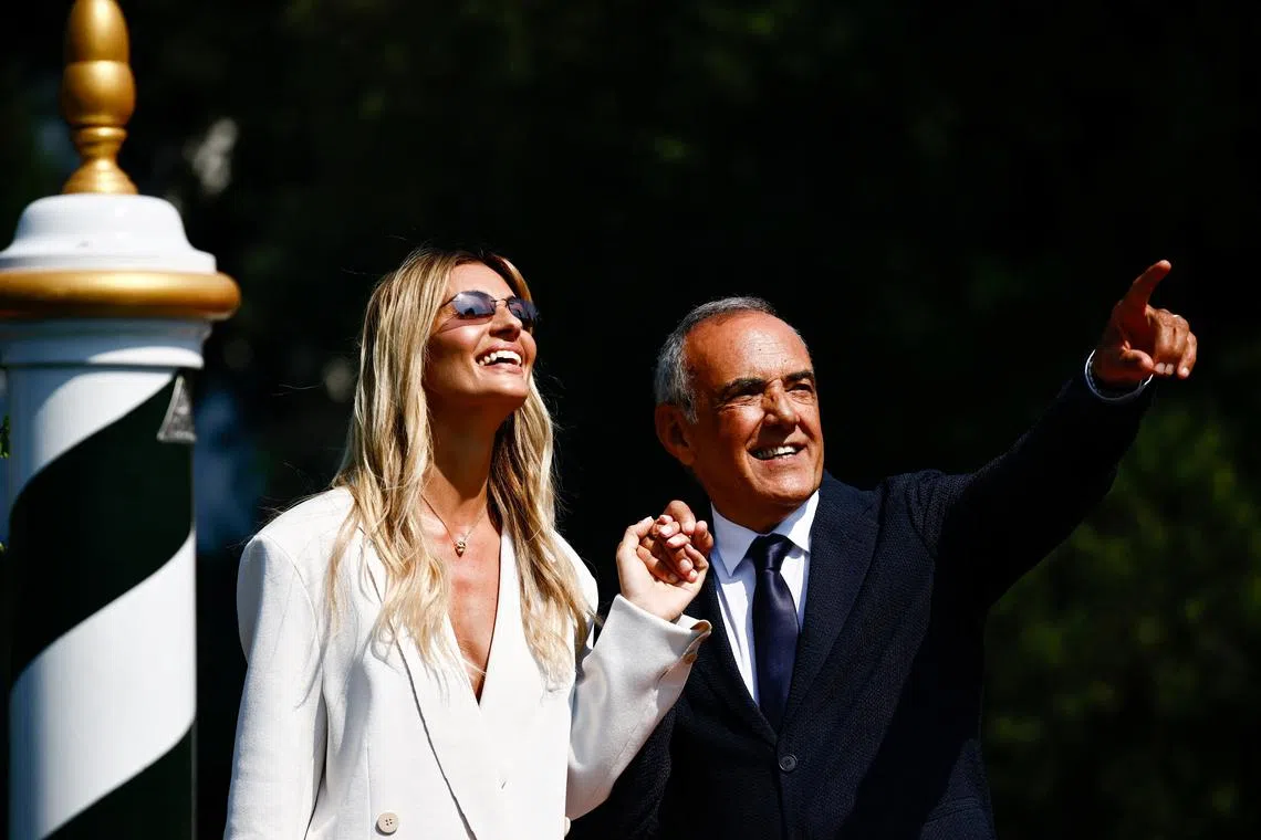 Actor Sveva Alviti, who will host the opening ceremony of the 81st Venice Film Festival, and director Alberto Barbera react, in Venice, Italy, August 27, 2024. REUTERS/Yara Nardi