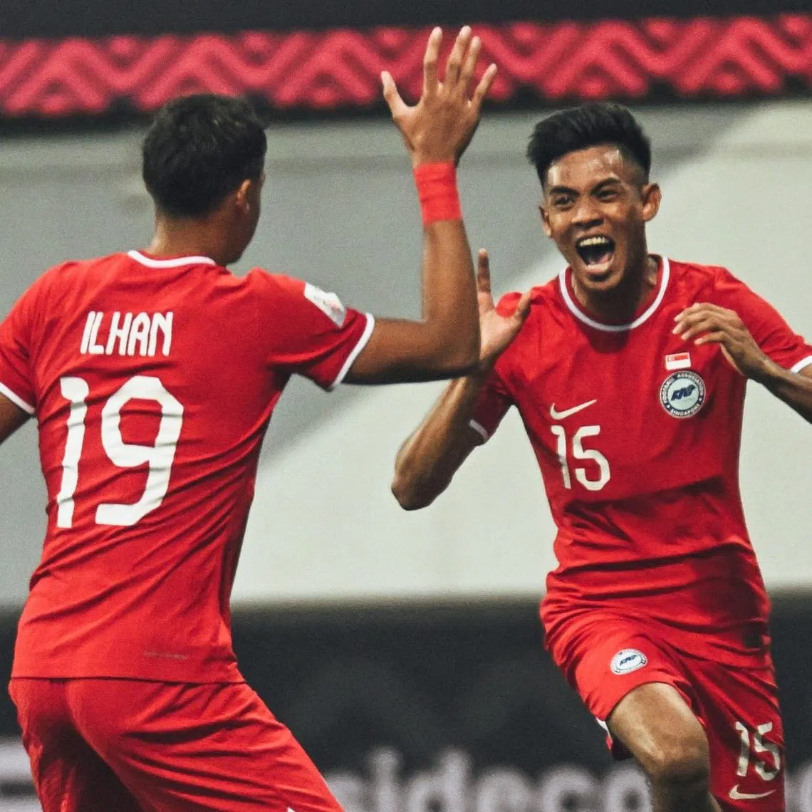 Shah Shahiran (right) celebrating with Ilhan Fandi after scoring Singapore's second goal in the 3-2 win over Myanmar on Saturday.