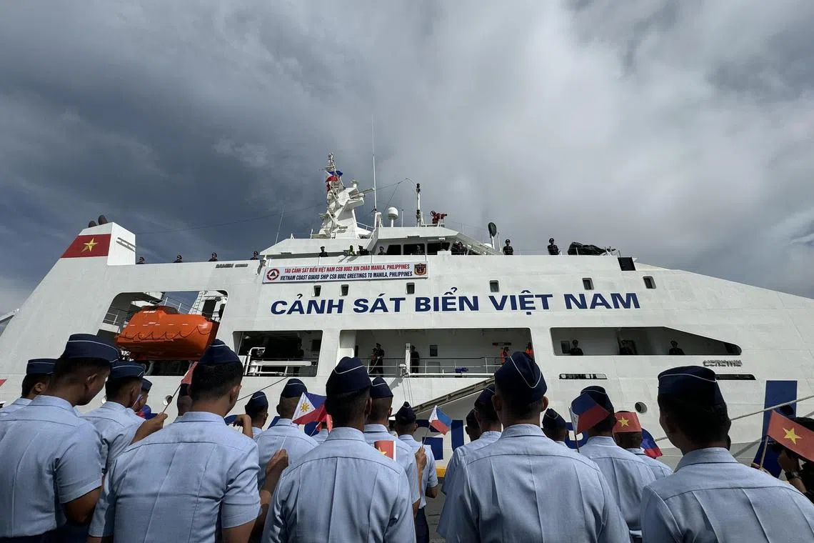 The Philippine Coast Guard welcomes Vietnam's CSB 8002 vessel as it arrives for a five-day visit in Manila on August 5, 2024.