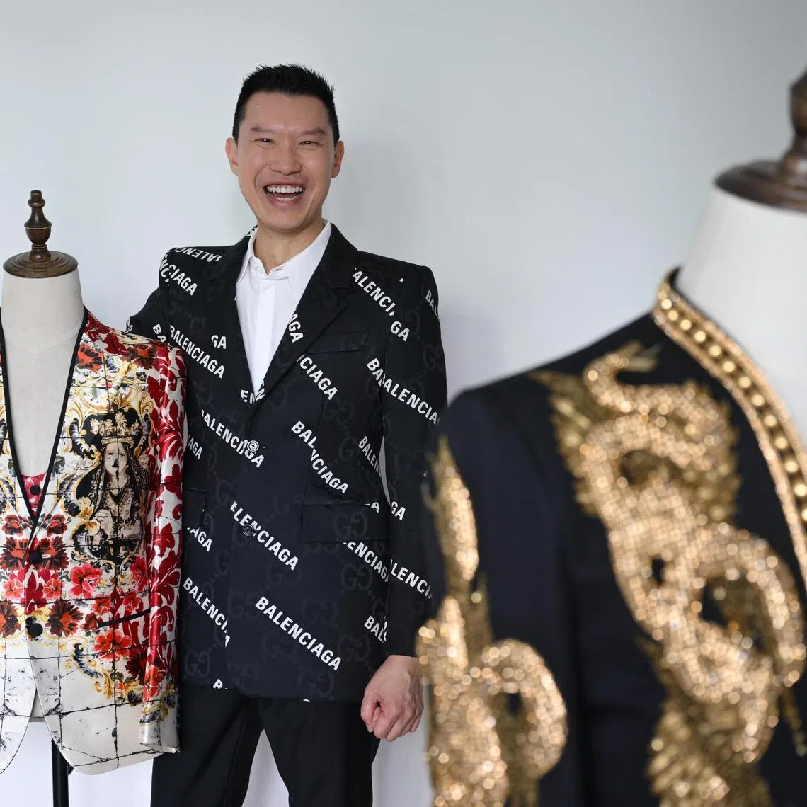 NUS law professor David Tan with his jacket from Dolce & Gabbana (left) and another from Balmain.