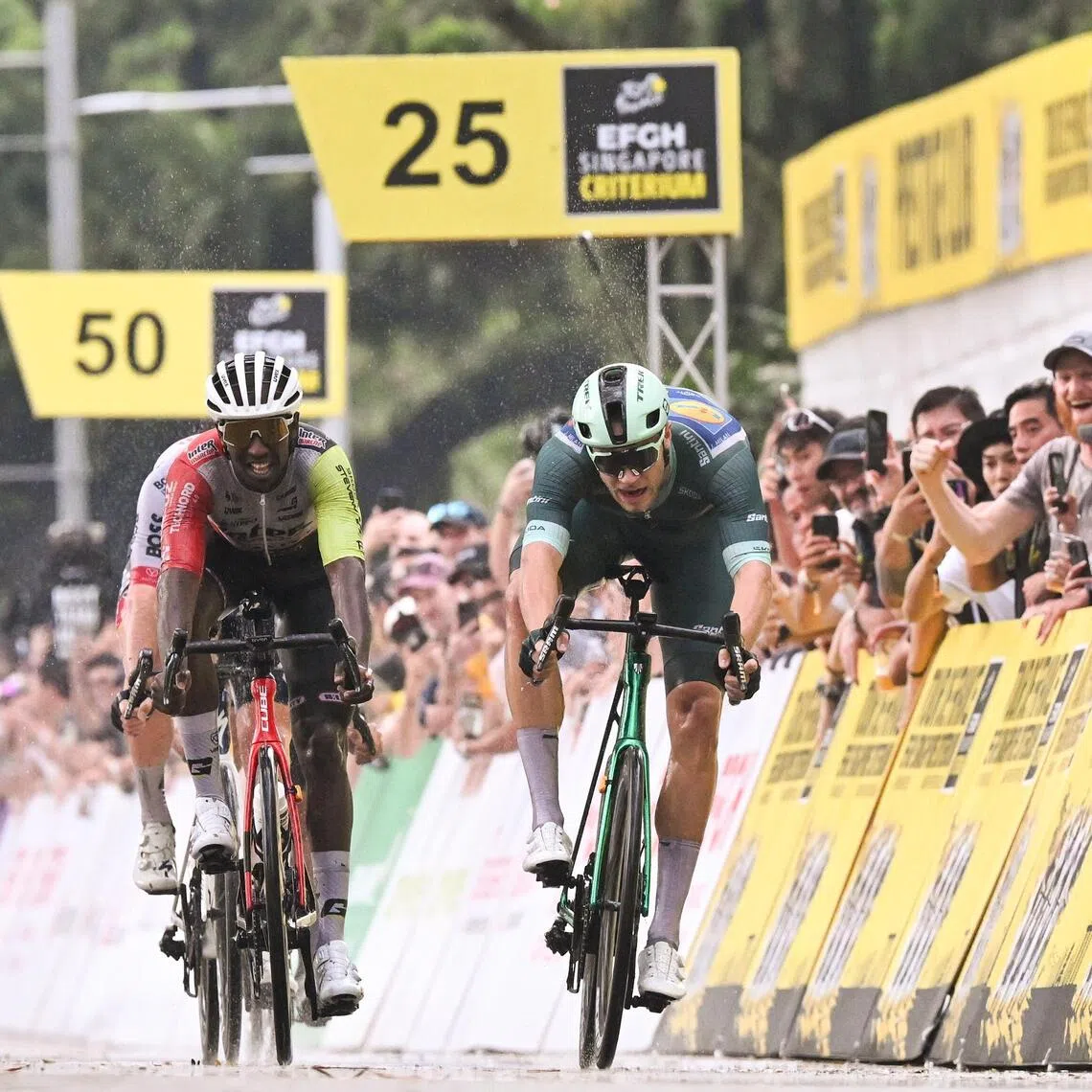 ST20251102-202568600408-Lim Yaohui-Deepanraj Ganesan-dgcycle02/
(From right to left) Jonathan Milan came in first, followed by Biniam Girmay (middle) and Dorian Godon came in 5th in the Professional Criterium Race during Tour de France EFGH Singapore Criterium 2025 along Connaught Drive on Nov 2, 2025.
Singapore is set to welcome the world’s elite cyclists for the Tour de France EFGH Singapore Criterium 2025, returning on 1 - 2 November 2025 for its fourth edition. This year’s event brings together seven stage winners from the 2025 Tour de France, including Primož Roglič, Jonathan Milan, Biniam Girmay, and Jasper Philipsen—the past three Green Jersey winners.
The 2025 route will once again transform the Marina Bay area into a high-speed urban circuit, with riders racing past landmarks such as the Padang, Merlion, and Esplanade – Theatres on the Bay.
(ST PHOTO: LIM YAOHUI)