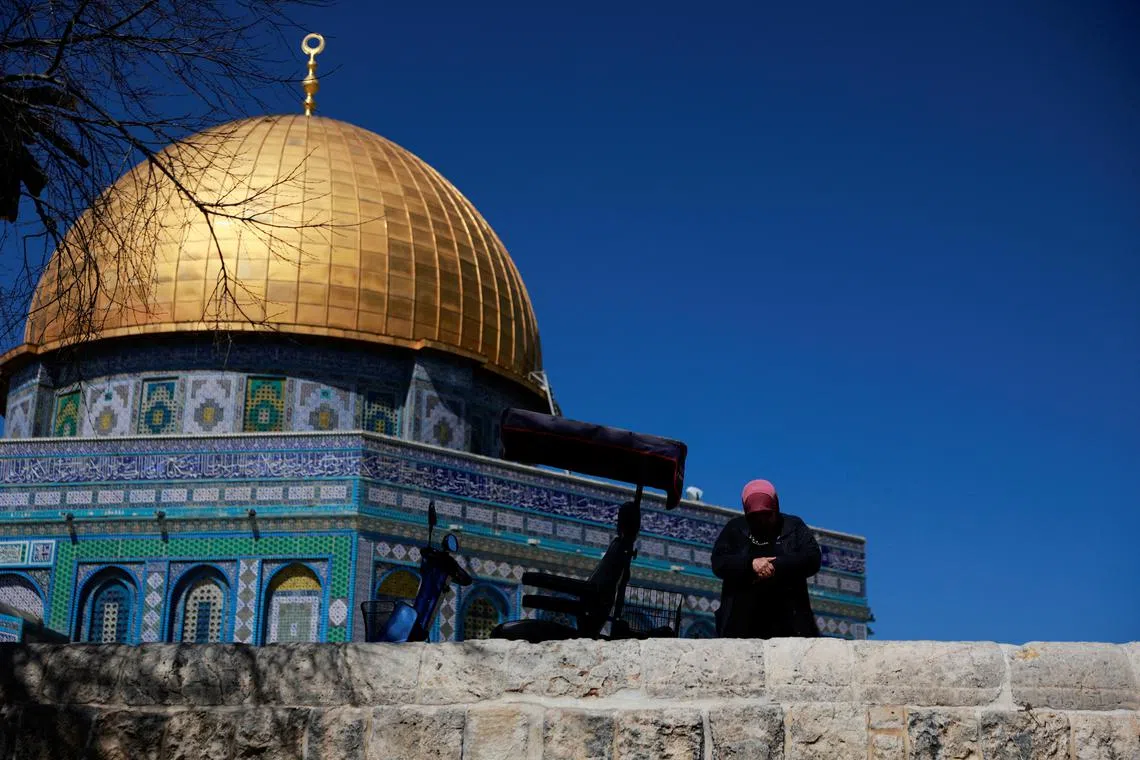 A Palestinian woman prays at the al-Aqsa compound, also known to Jews as the Temple Mount, amid the ongoing conflict between Israel and the Palestinian group Hamas, in Jerusalem's Old City March 5, 2024. REUTERS/Ammar Awad