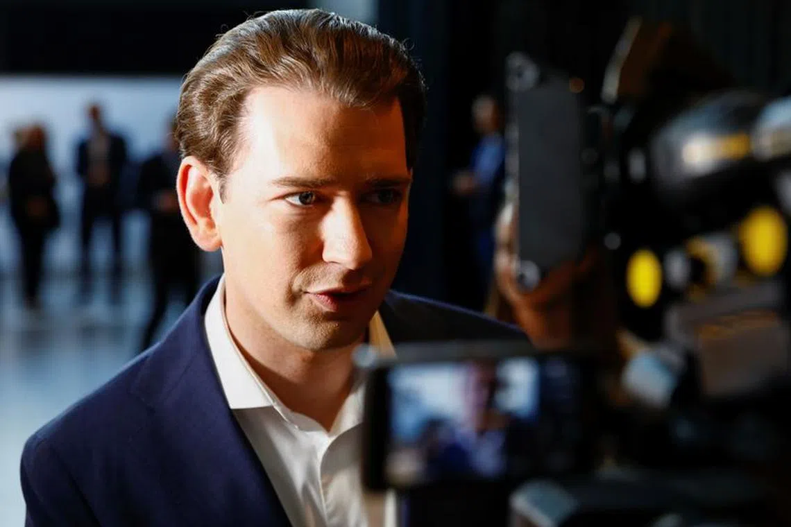 Former Austrian Chancellor Sebastian Kurz speaks to media as he arrives at the Austrian People's Party (OeVP) conference in Graz, Austria May 14, 2022. REUTERS/Lisa Leutner/File Photo