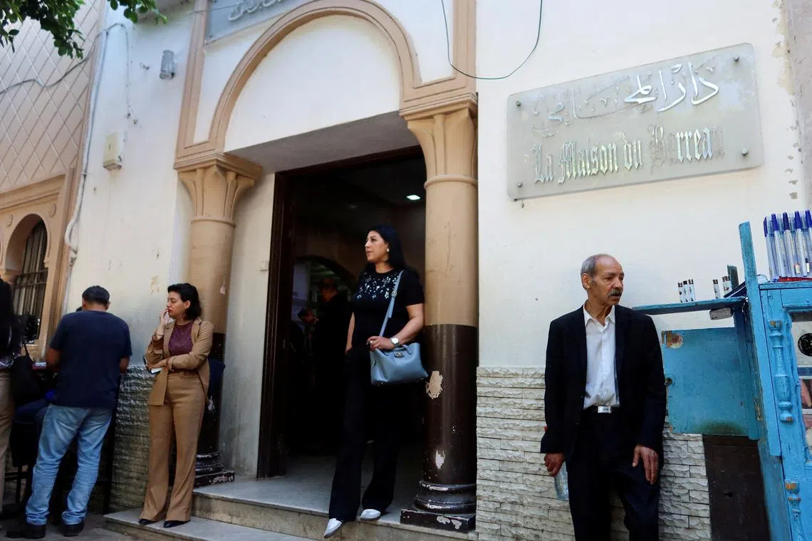 FILE PHOTO: A woman walks out of the building of the Deanship of Lawyers in Tunis, Tunisia May 13, 2024. REUTERS/Jihed Abidellaoui/File Photo