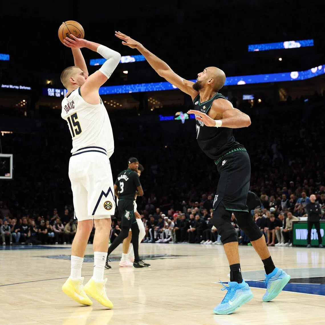 Nikola Jokic of the Denver Nuggets shoots the ball against Rudy Gobert of the Minnesota Timberwolves in the second quarter of Game 3.