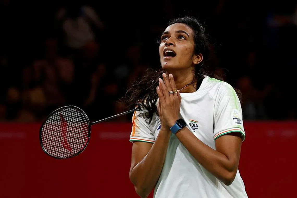 FILE PHOTO: Commonwealth Games - Badminton - Women's Singles - Gold Medal Match -The NEC Hall 5, Birmingham, Britain - August 8, 2022 India's Venkata Sindhu Pusarla celebrates after winning gold REUTERS/Jason Cairnduff/File Photo